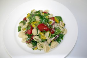 Colorful confetti pasta salad served on a plate