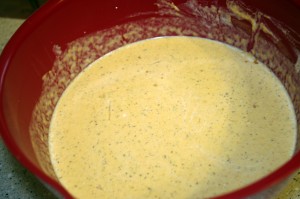 Mixing pumpkin bread pudding batter